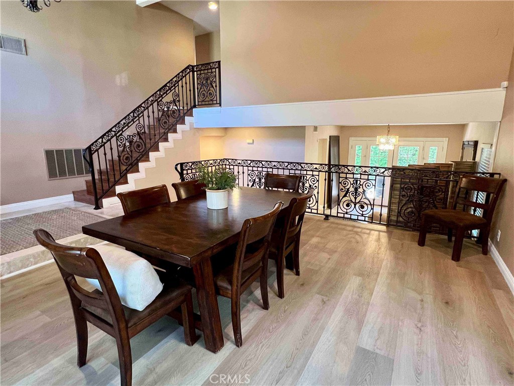 500 Silver Canyon Way Brea, CA 92821 - Photo 3 of 24 a view of a dining room with furniture and wooden floor