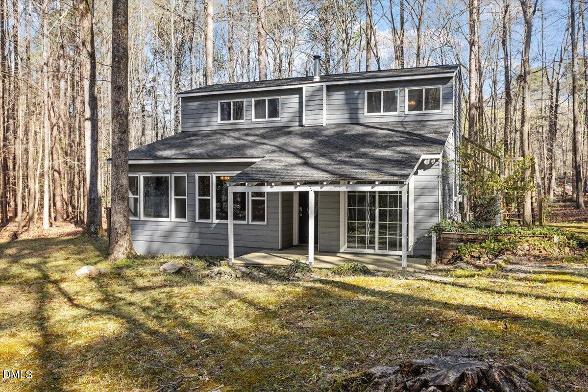 1423 Alderman Circle Raleigh, NC 27603 - Photo 1 of 37 a front view of a house with a garden