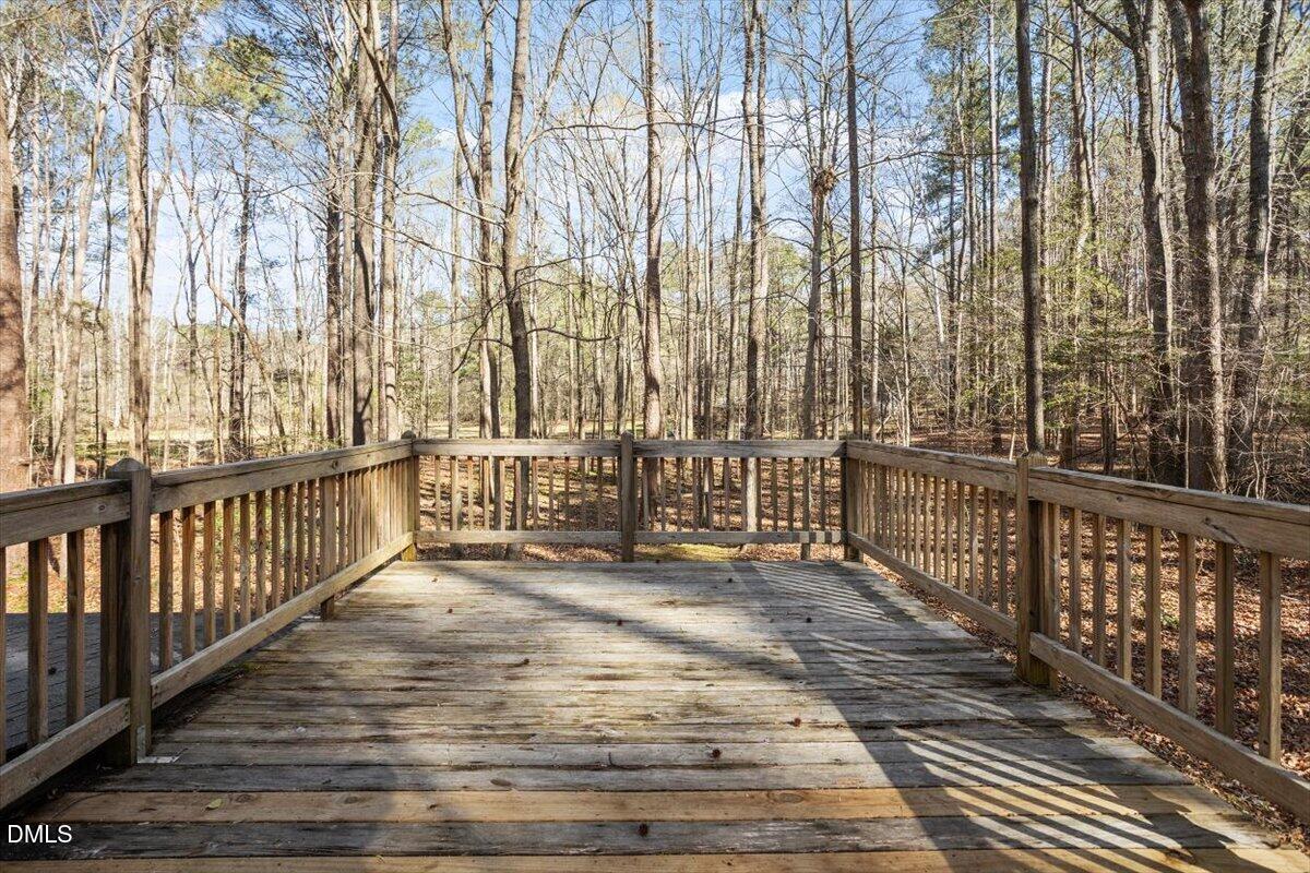 1423 Alderman Circle Raleigh, NC 27603 - Photo 16 of 37 a view of a balcony with wooden floor and fence