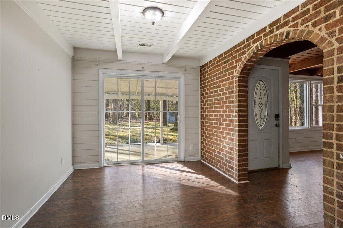 1423 Alderman Circle Raleigh, NC 27603 - Photo 29 of 37 an empty room with wooden floor and windows