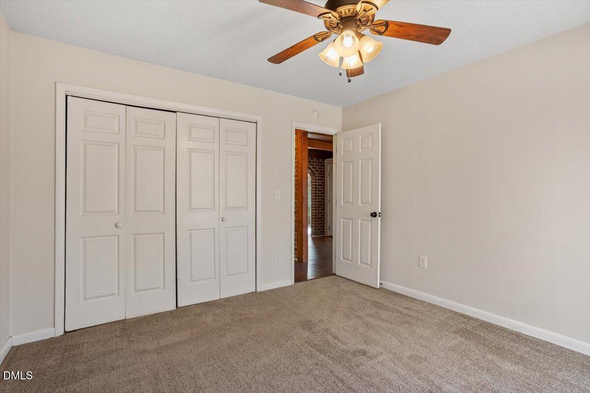 1423 Alderman Circle Raleigh, NC 27603 - Photo 31 of 37 an empty room with windows and fan
