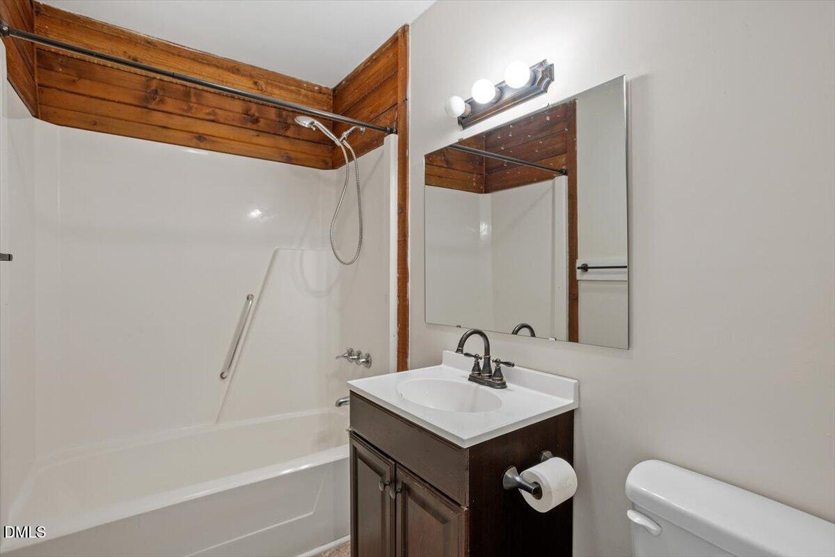 1423 Alderman Circle Raleigh, NC 27603 - Photo 36 of 37 a bathroom with a sink a toilet and shower