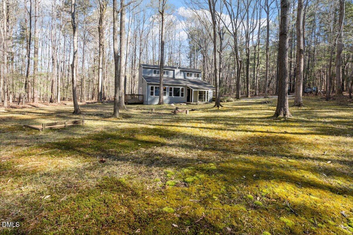 1423 Alderman Circle Raleigh, NC 27603 - Photo 5 of 37 a swimming pool with trees in front of it