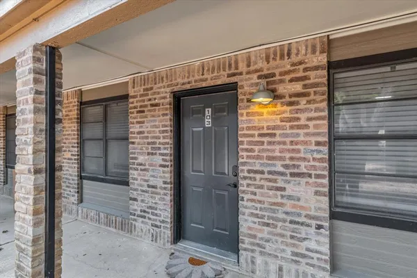 a view of front door and wooden door