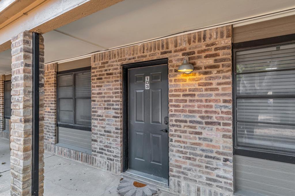 1421 South 12th Street, Unit 103 Waco, TX 76706 - Photo 1 of 17 a view of front door and wooden door