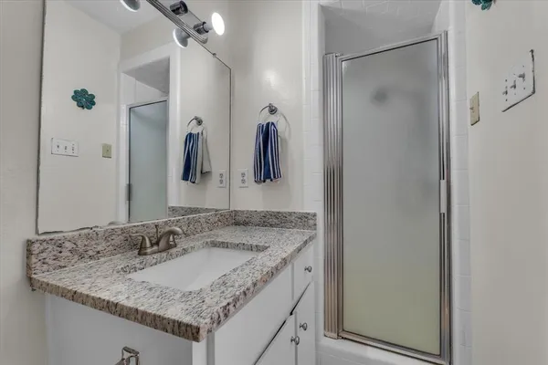 a view of a workspace with furniture and a workspace