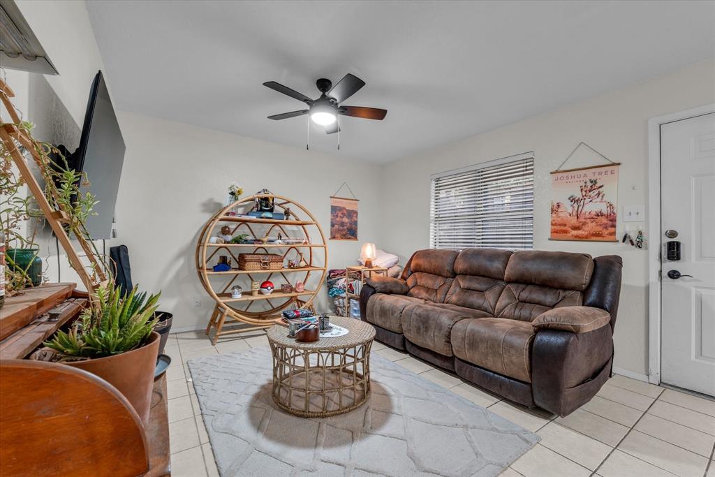 1421 South 12th Street, Unit 103 Waco, TX 76706 - Photo 3 of 17 a living room with furniture and a flat screen tv