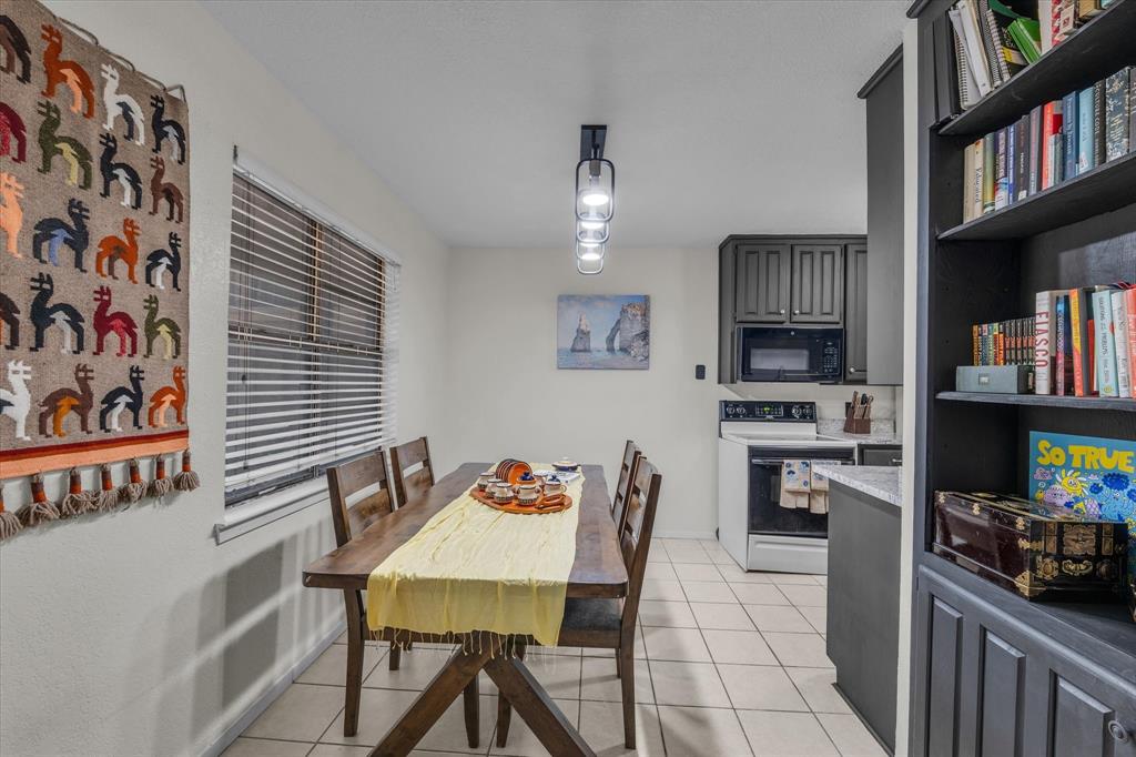 1421 South 12th Street, Unit 103 Waco, TX 76706 - Photo 5 of 17 a view of a dining room with furniture and a kitchen