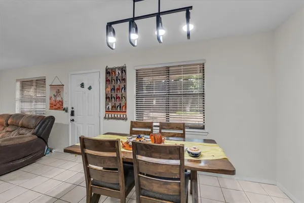 a kitchen with granite countertop a sink stove and cabinets