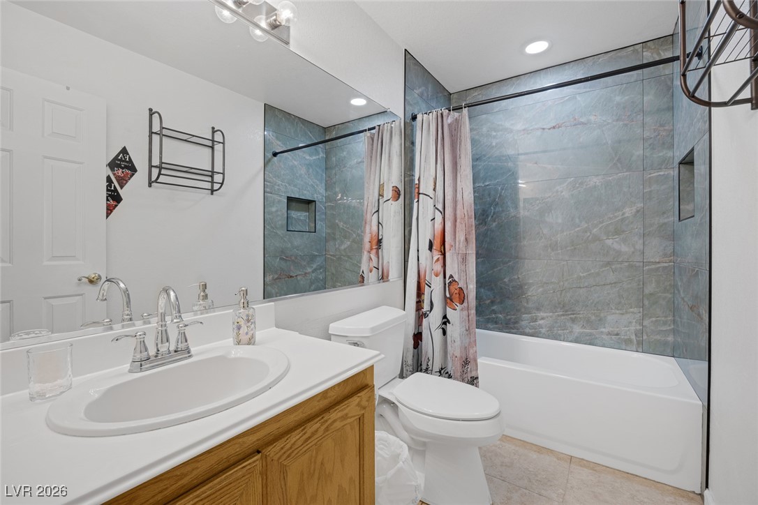 2427 Worchester Road Henderson, NV 89074 - Photo 24 of 35 Bathroom with vanity, shower / bathtub combination with curtain, light tile patterned floors, and recessed lighting