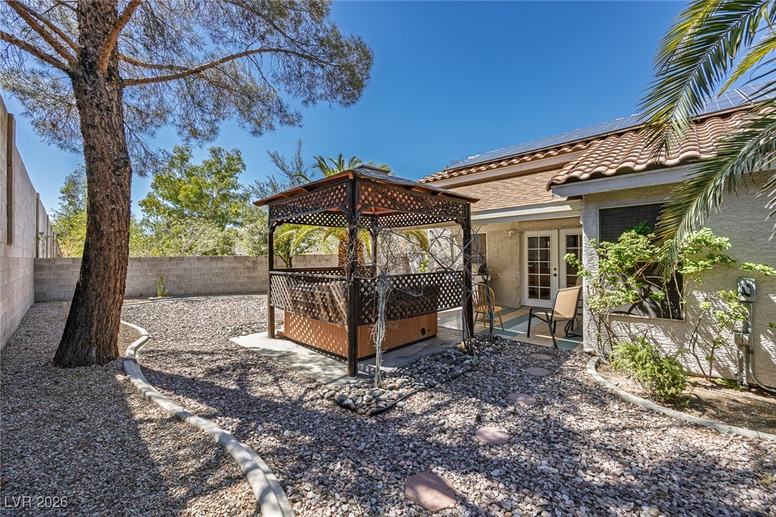 2427 Worchester Road Henderson, NV 89074 - Photo 31 of 35 Fenced backyard with a gazebo, a patio, and french doors
