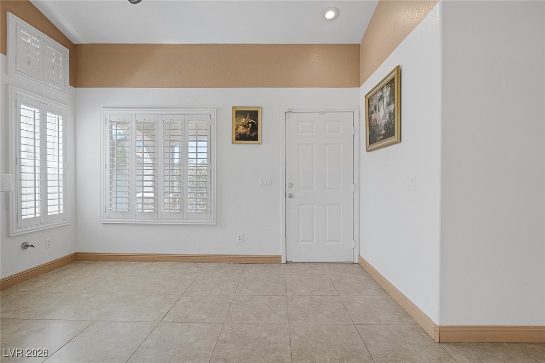 2427 Worchester Road Henderson, NV 89074 - Photo 6 of 35 Unfurnished room featuring baseboards and light tile patterned flooring