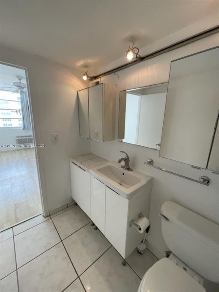 Millionaire's Row Miami Beach, FL 33140 - Photo 13 of 16 a bathroom with a sink toilet and mirror