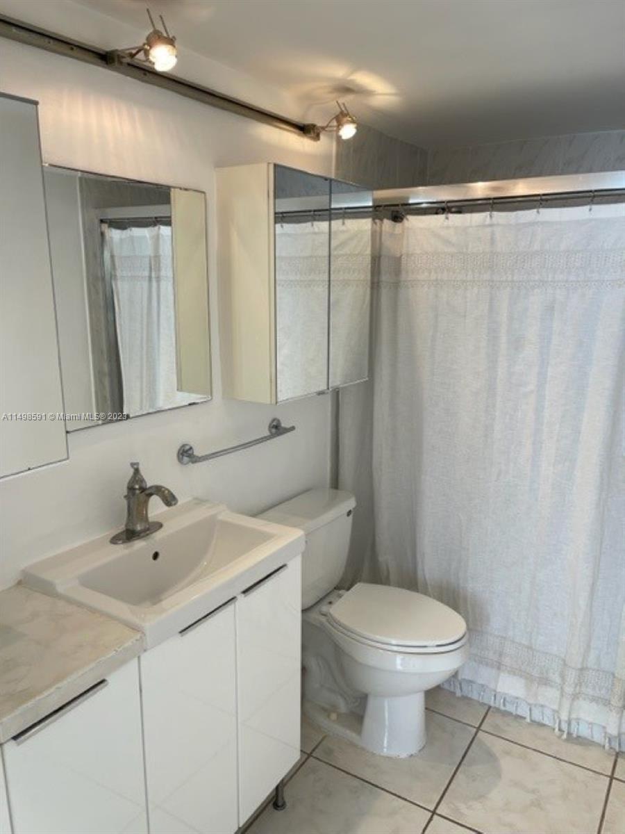 Millionaire's Row Miami Beach, FL 33140 - Photo 6 of 16 a bathroom with a sink a toilet a mirror and shower