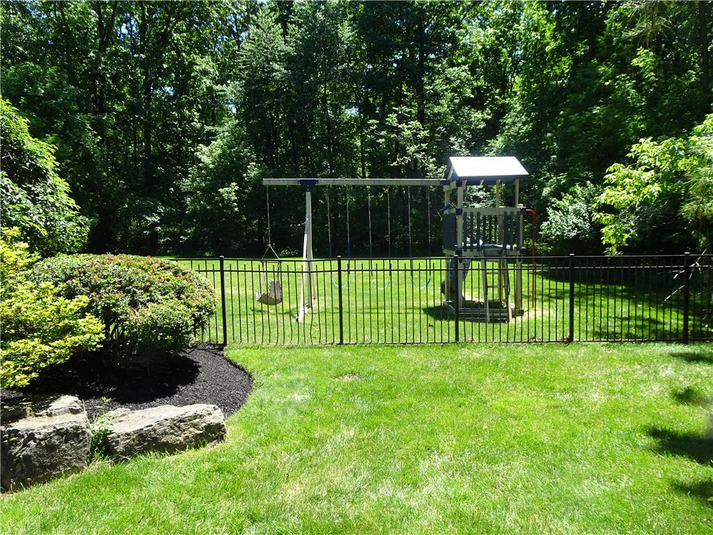 1371 Stoke Park Road Bethlehem, PA 18017 - Photo 5 of 12 A private, fenced backyard offers a playset for boundless outdoor enjoyment.