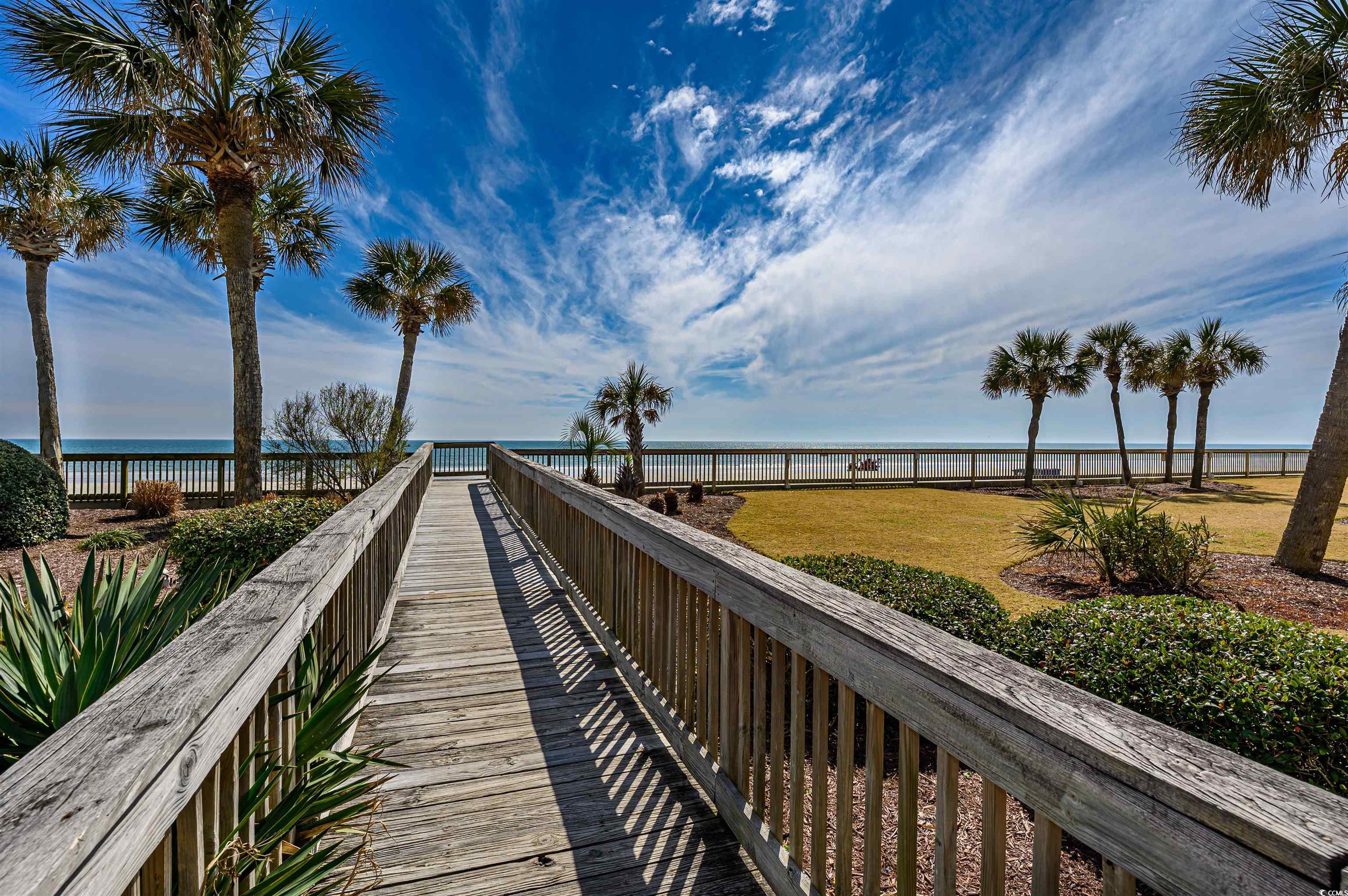 10200 Lakeshore Drive, Unit 16 Myrtle Beach, SC 29572 - Photo 14 of 36 View of home's community with a yard, a water view, and fence