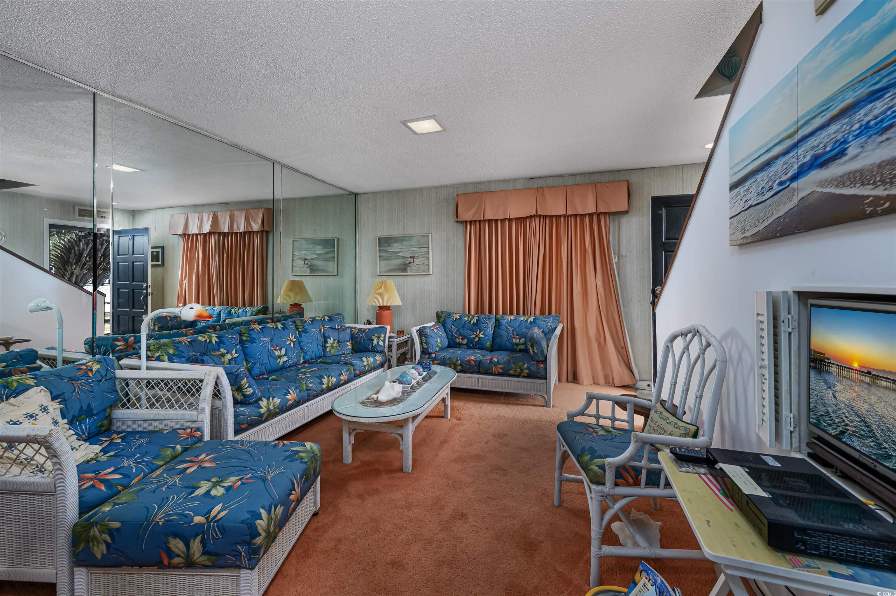10200 Lakeshore Drive, Unit 16 Myrtle Beach, SC 29572 - Photo 25 of 36 Living room featuring carpet floors and a textured ceiling