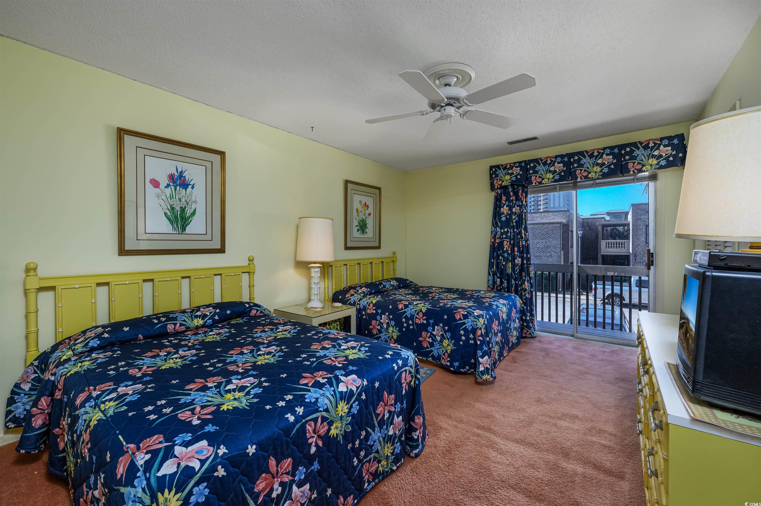 10200 Lakeshore Drive, Unit 16 Myrtle Beach, SC 29572 - Photo 30 of 36 Carpeted bedroom with access to outside, a textured ceiling, visible vents, and a ceiling fan