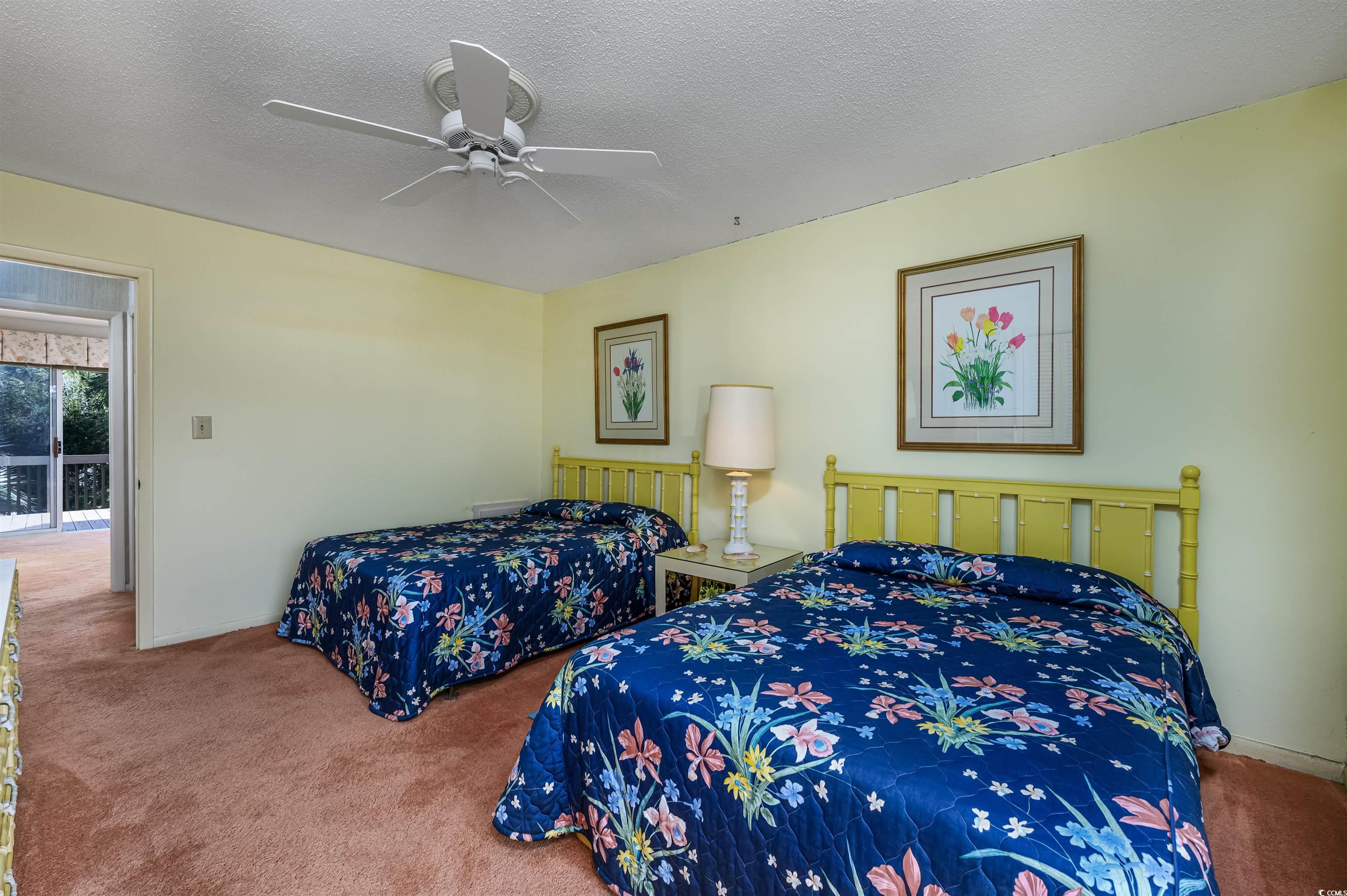 10200 Lakeshore Drive, Unit 16 Myrtle Beach, SC 29572 - Photo 31 of 36 Carpeted bedroom with a textured ceiling, ceiling fan, and baseboards