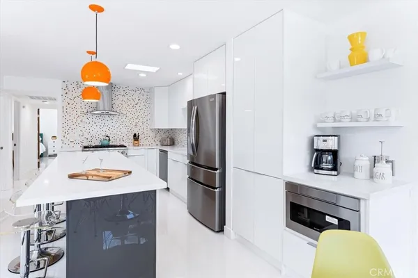 a kitchen with a sink cabinets and appliances