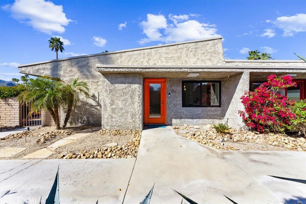 1111 Ramon Road, Unit 87 Palm Springs, CA 92264 - Photo 2 of 54 a front view of a house with a garage