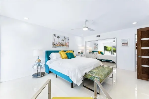 a bedroom with a bed and window