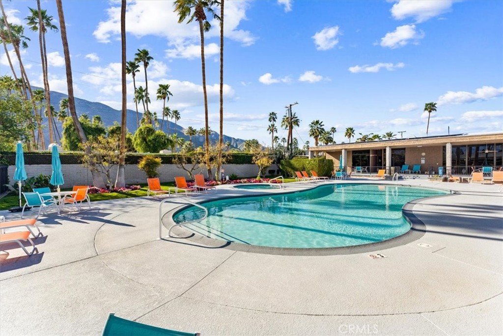 1111 Ramon Road, Unit 87 Palm Springs, CA 92264 - Photo 44 of 54 a view of a swimming pool with a patio and plants
