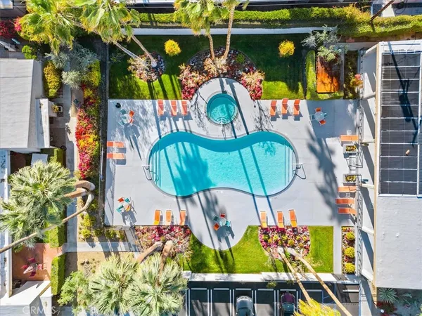 a living room with furniture a window and a clock
