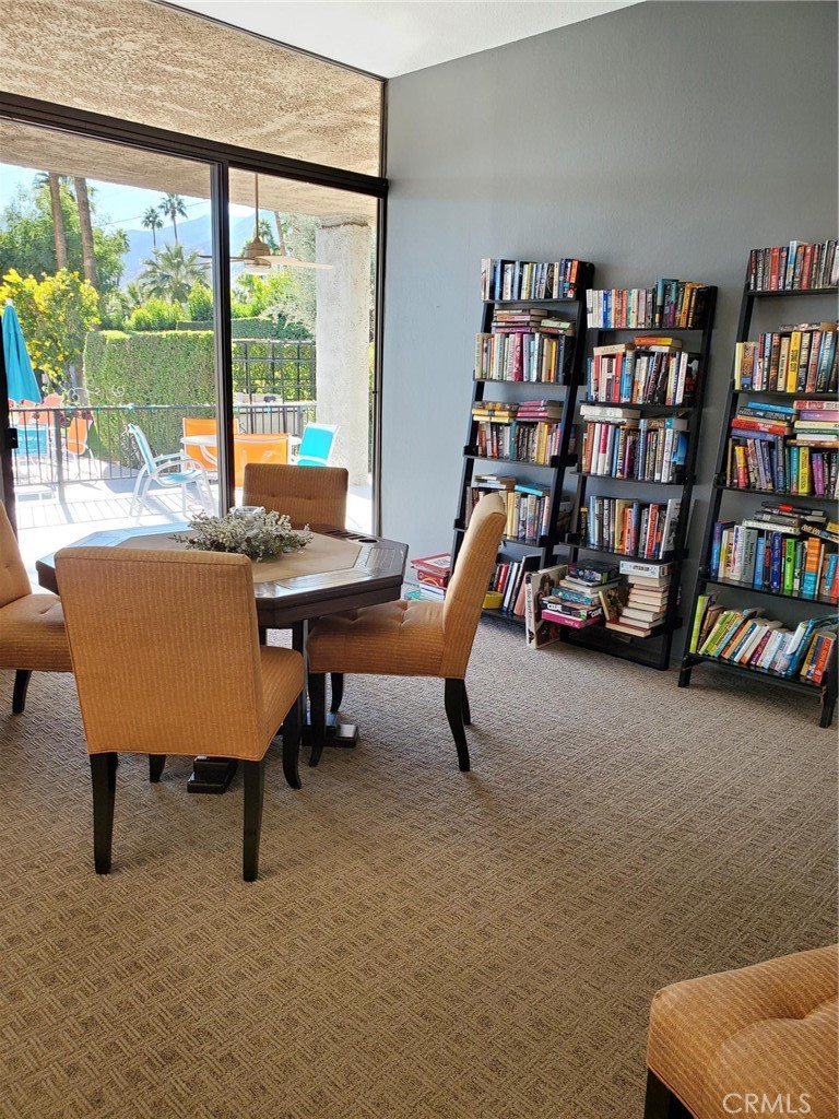 1111 Ramon Road, Unit 87 Palm Springs, CA 92264 - Photo 53 of 54 a reading room with furniture book shelf and a large window