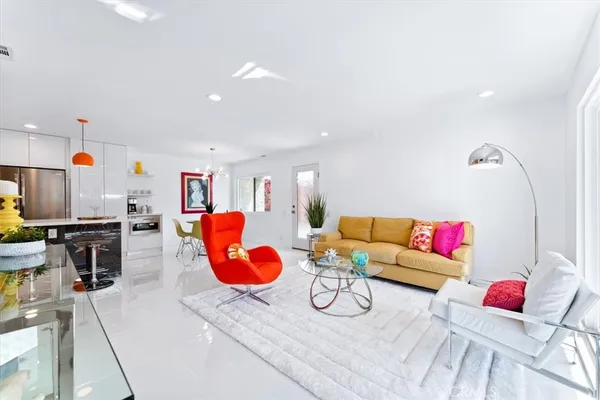 a living room with furniture and a table