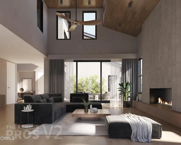 a living room with furniture fireplace and window