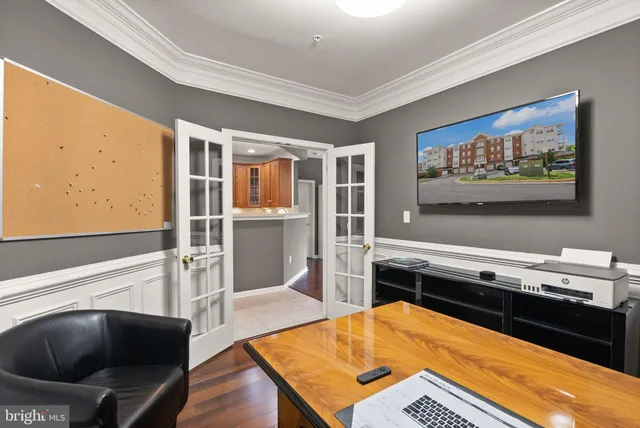 a view of kitchen with stainless steel appliances granite countertop refrigerator sink and cabinets