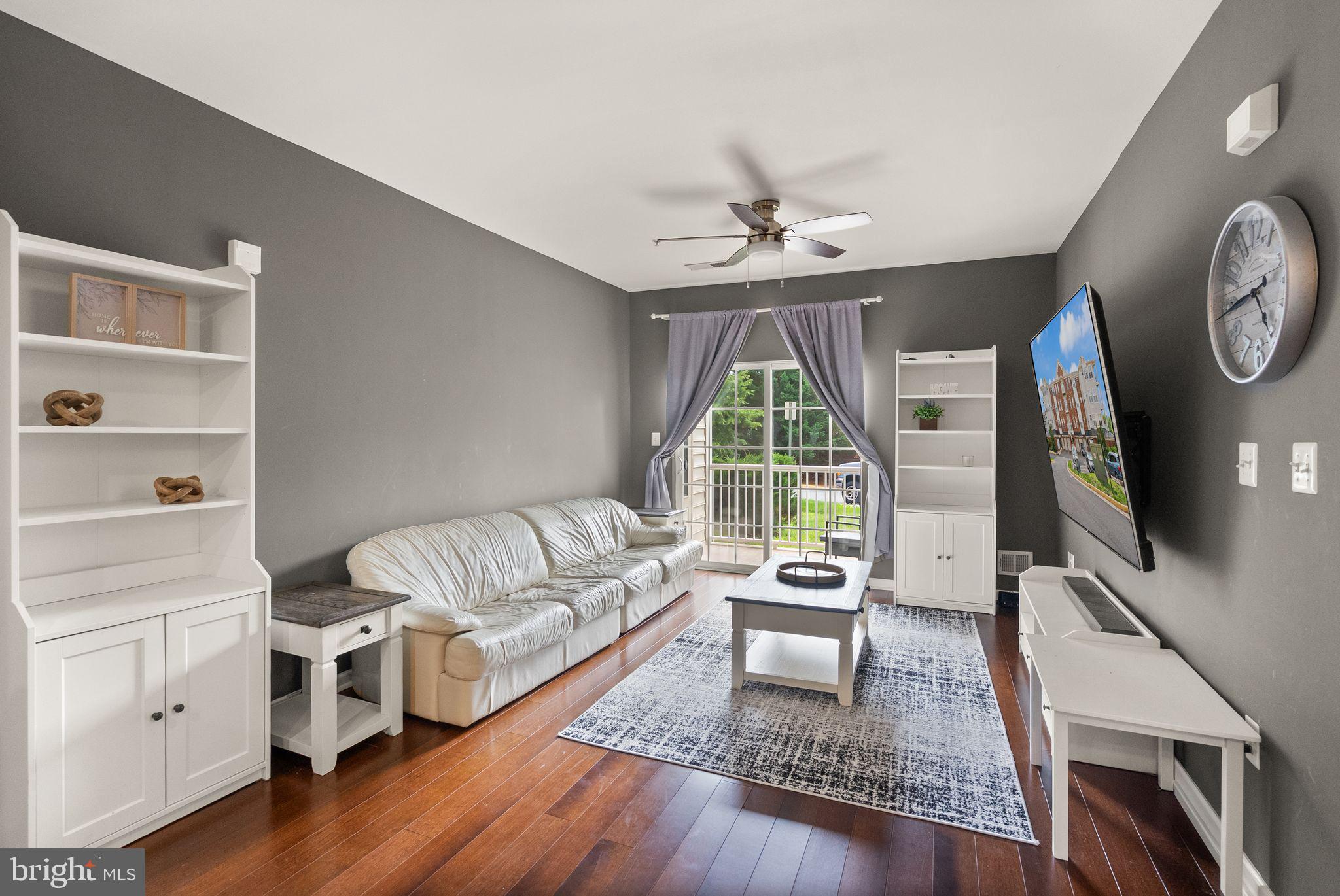 9710 Handerson Place, Unit 1 Manassas Park, VA 20111 - Photo 14 of 41 a living room with furniture and a flat screen tv