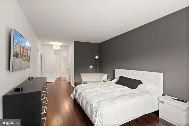 a bedroom with a bed and a dresser