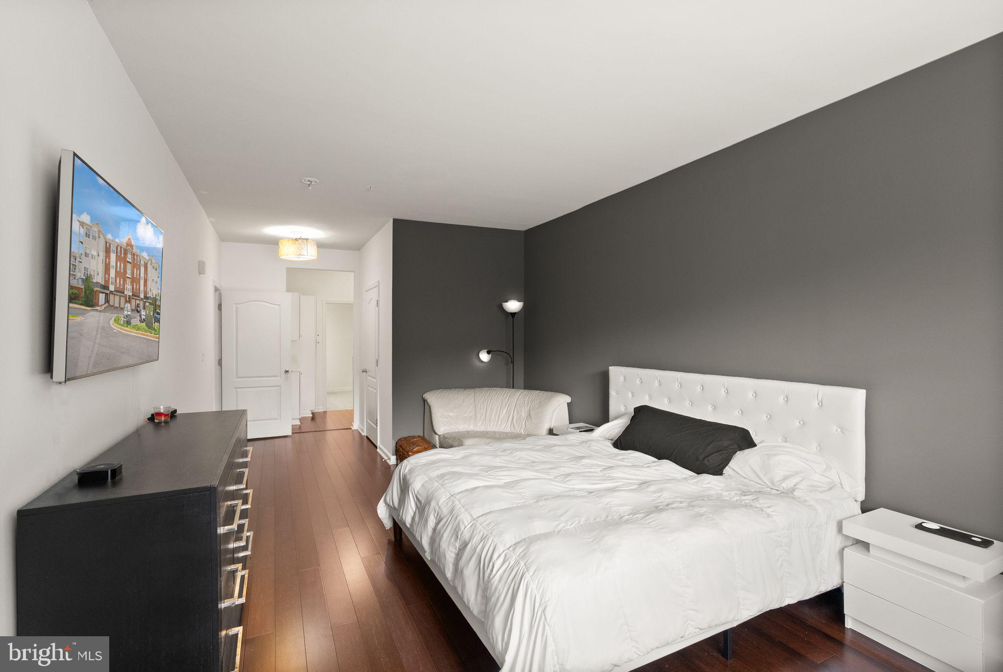 9710 Handerson Place, Unit 1 Manassas Park, VA 20111 - Photo 18 of 41 a bedroom with a bed and wooden floor