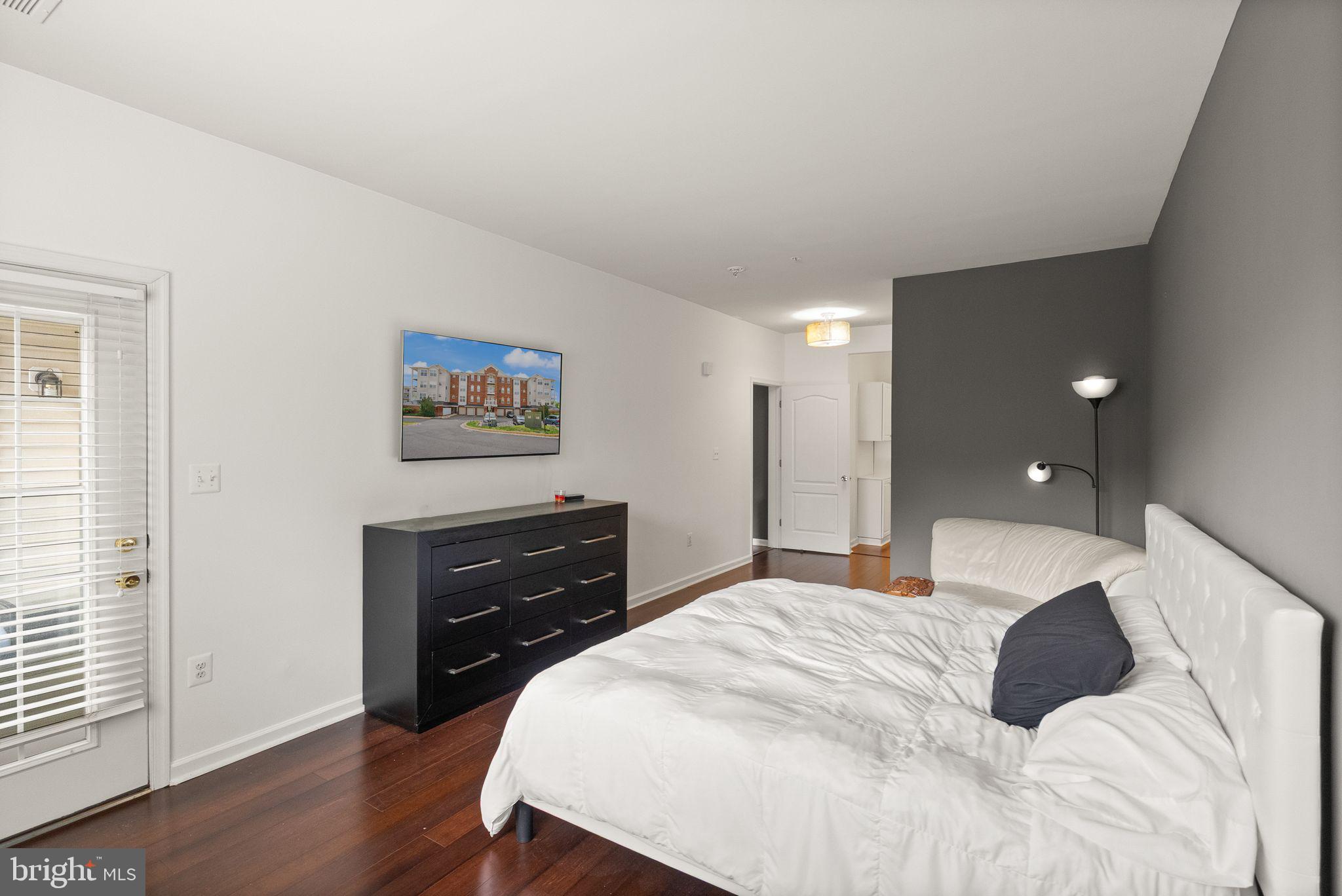 9710 Handerson Place, Unit 1 Manassas Park, VA 20111 - Photo 19 of 41 a bedroom with a bed and a dresser