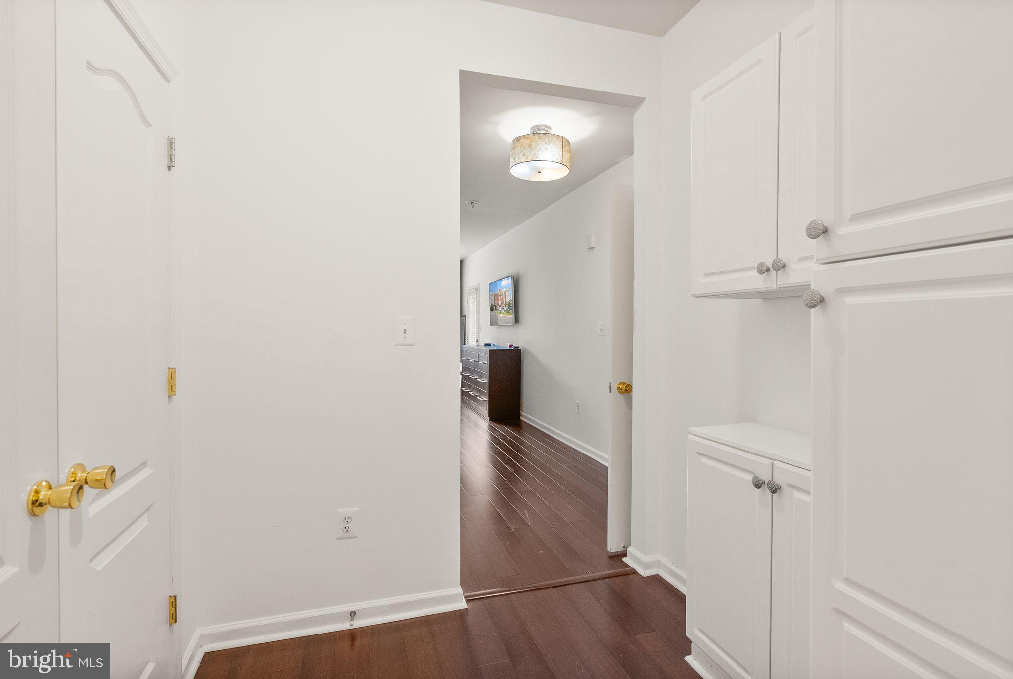 9710 Handerson Place, Unit 1 Manassas Park, VA 20111 - Photo 21 of 41 a view of a hallway view with wooden floor and staircase