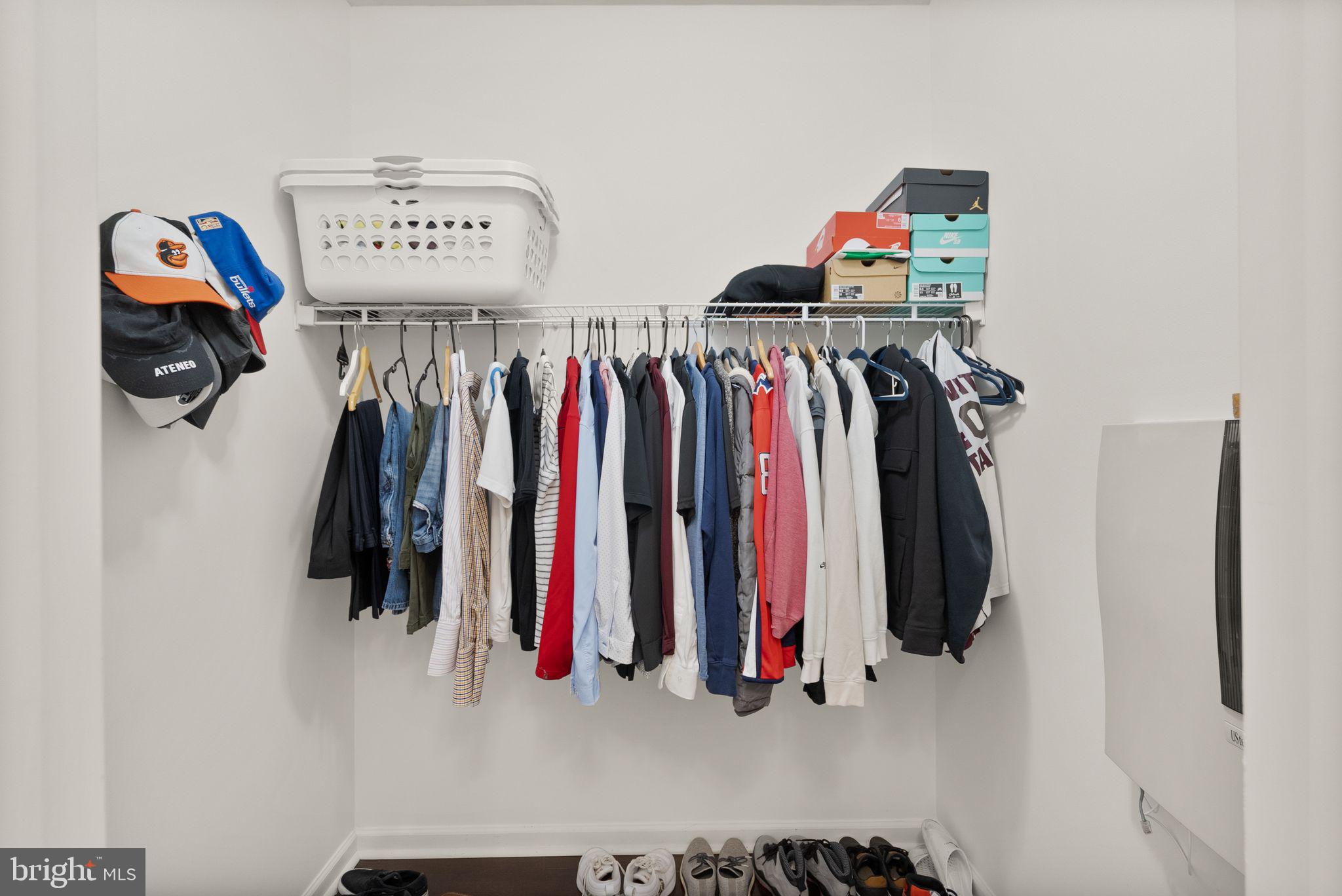 9710 Handerson Place, Unit 1 Manassas Park, VA 20111 - Photo 26 of 41 a view of walk in closet with clothes and shoes