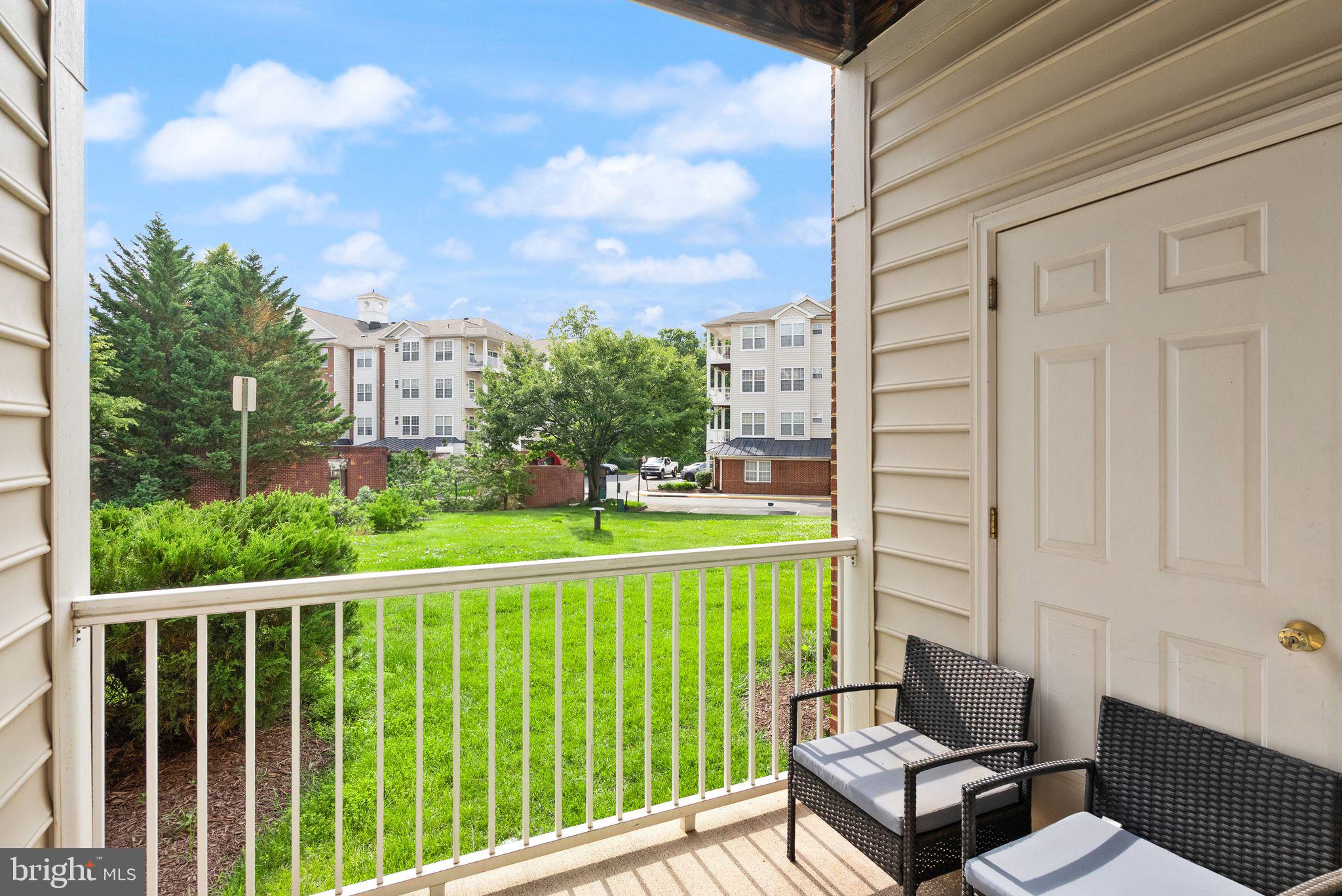 9710 Handerson Place, Unit 1 Manassas Park, VA 20111 - Photo 34 of 41 a view of a chair and tables in the balcony