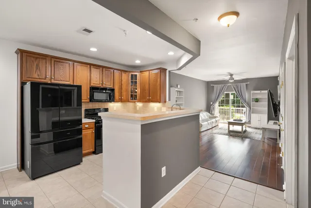 a large kitchen with a sink and cabinets
