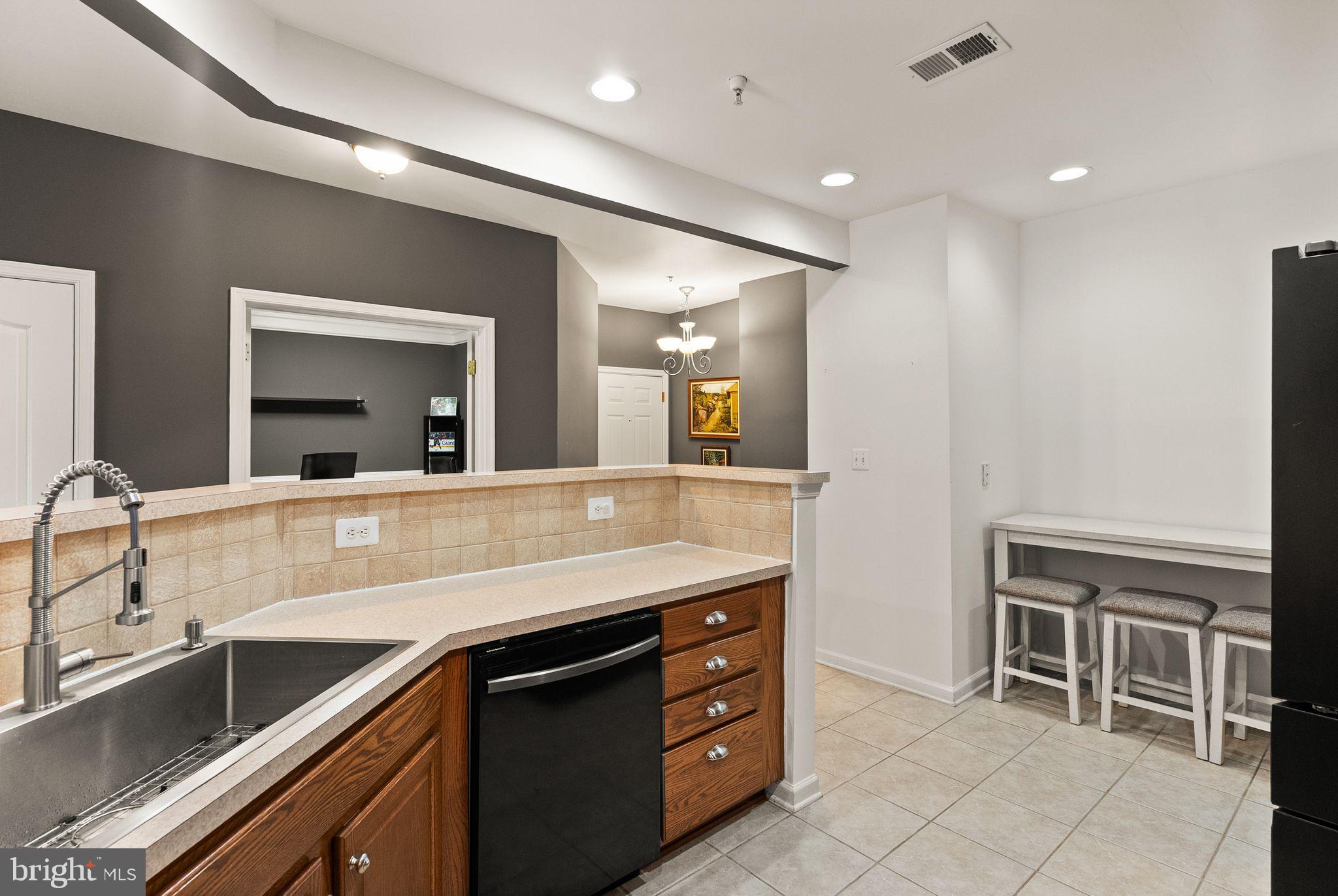 9710 Handerson Place, Unit 1 Manassas Park, VA 20111 - Photo 10 of 41 a bathroom with a sink a vanity and a mirror