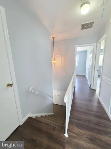 a view of entryway with wooden floor