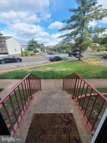 a view of a patio with a yard