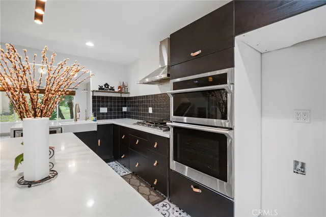 a kitchen with a sink and cabinets