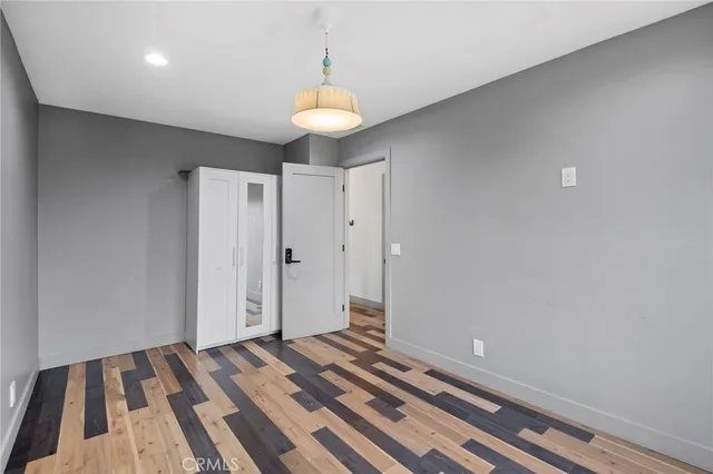 a view of room with wooden floor