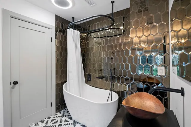 a white toilet sitting next to a white wall