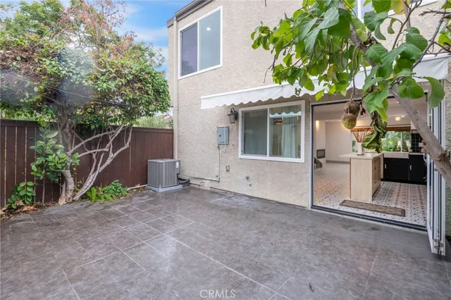 a bathroom with a granite countertop toilet sink and mirror