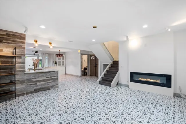 a bathroom with a sink toilet a mirror and shower