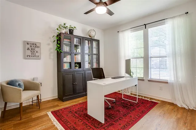 a workspace with furniture hardwood and a window