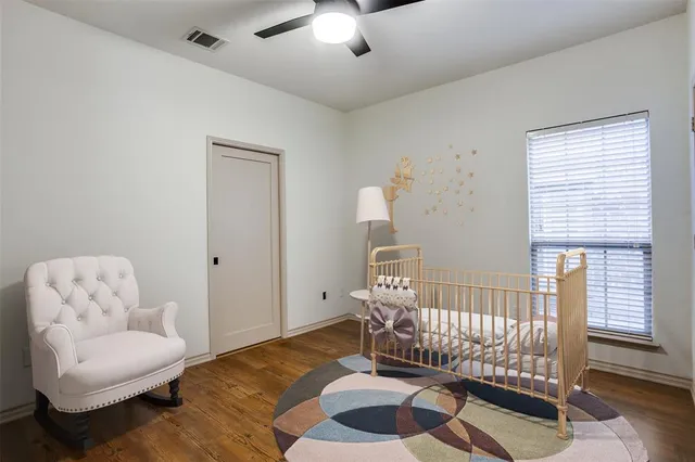 a spacious bedroom with a bed and a couch